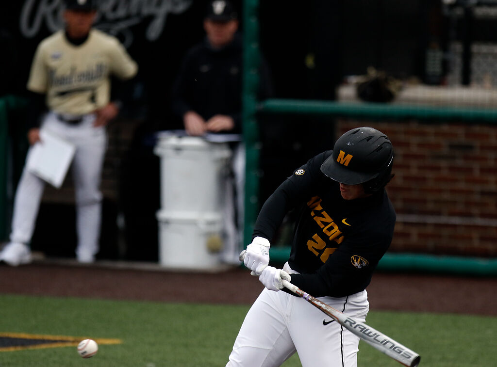 Designated hitter Chad McDaniel swings at the ball
